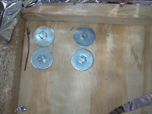 These are the bolts which hold the casters on. I used fender washers so there would be less risk of the wood splitting since they cover a greater surface area than regular washers.