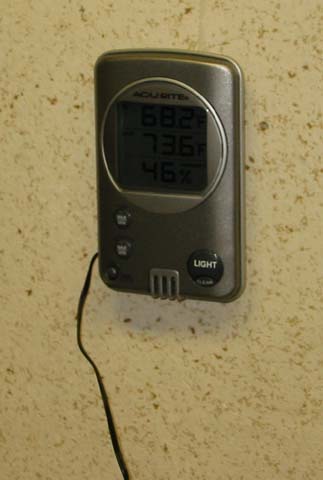 I'm monitoring the temperature inside the growbox using a digital thermometer with remote sensor.  I got it at WalMart for about $15.