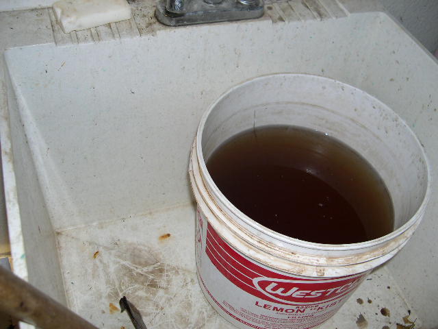 This is where PG mixes his fertilizers. It is not sanitary, and this is how he stores the tea after it is made.